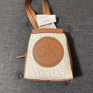 This is a Calvin Klein Millie Signature Convertible Sling Backpack